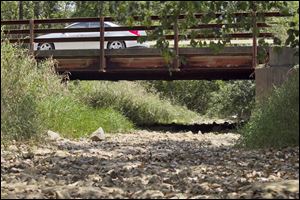 A creek bed just north of Sylvania in Whiteford Township, Michigan, is completely dry as the drought in the Midwest continues with temperatures in the 90s and scant rainfall for weeks.