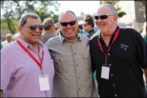 From left, Rick Salem, volunteer for the Boys and Girls Clubs, David Wehrmeist er, executive director of the club, and Don Harbaugh , member of the life board, at the Party in the Parking Lot.