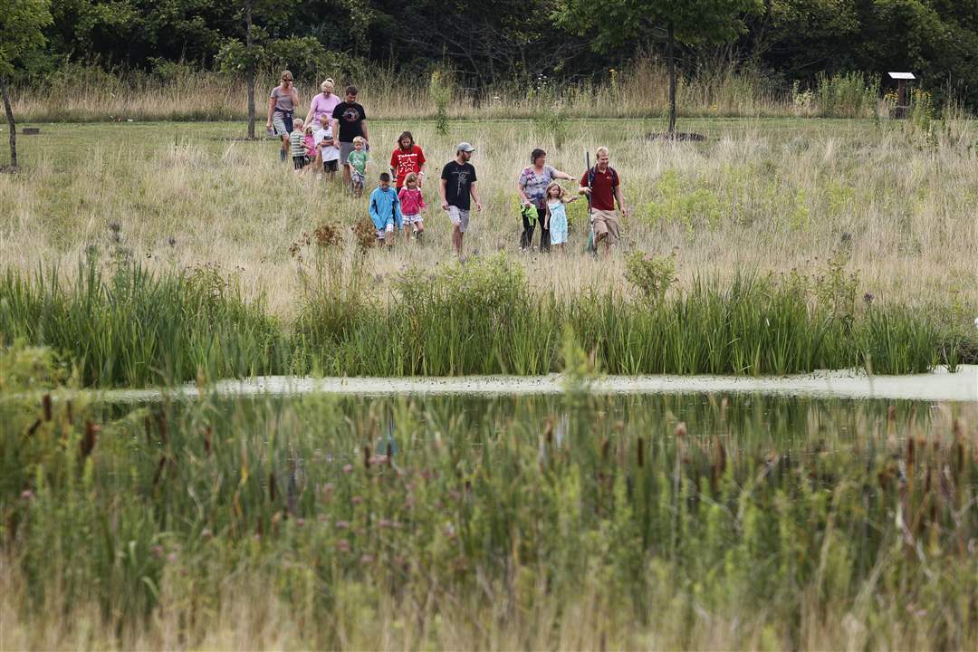 A-group-of-several-families-head-down-to-a-pond
