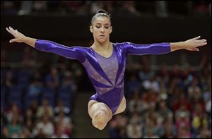 Aly Raisman helped the U.S. women's gymnastics team finish in first after qualifying. The U.S. must overcome shock though as Raisman edged world champ Jordyn Wieber to reach the all-around finals.