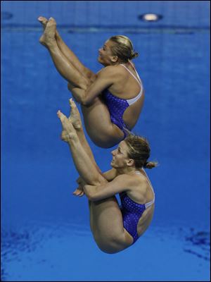 Abby Johnston, a Columbus-area native, front, and Kelci Bryant finished second with 321.90 points, ending the country's diving medal drought that extended to the 2000 Sydney Games. It was the first Olympic synchro medal for the U.S.