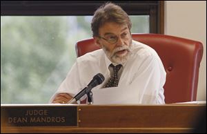 Lucas County Common Pleas Court Judge Dean Mandros reads a question from the jury regarding its inability to reach a  sentencing recommendation for Samual Williams, who was convicted of two counts of aggravated murder, two counts of kidnapping, and one count of aggravated burglary.