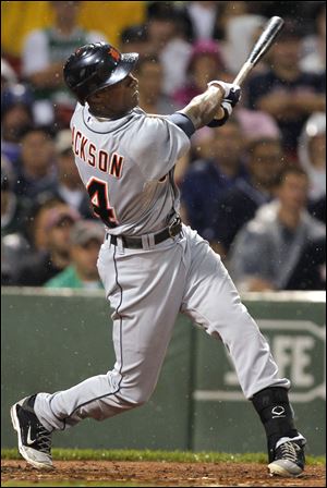 Detroit Tigers' Austin Jackson swings at a pitch by Boston Red Sox's Josh Beckett in the third inning of a baseball game at Fenway Park, in Boston, Tuesday.