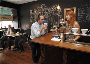 Bleak House co-owner Stephanie Wandtke chats with customer Mike Griffin on Thursday. The shop takes its name from Charles Dickens' novel about the complications of the English legal system.