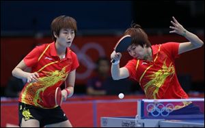 China's Ding Ning, left  and Li Xiaoxia play Spain's Gaila Dvorak, left, and Sara Ramirez during women's team table tennis competition at the 2012 Summer Olympics on Friday.