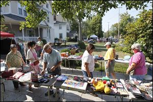 Shoppers look over merchandise  at yard sales along U.S. 127 in Van Wert, Ohio. The 25th annual World's Longest Yard Sale began Thursday and continues through Sunday.