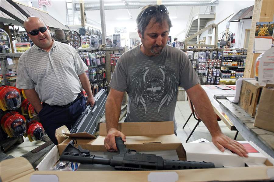 Brad-Bucholz-of-Defiance-displays-the-22-caliber-rifle