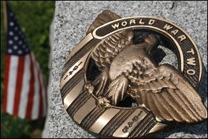 Sixty medallions similar to this were removed from Wauseon Union Cemetery. About 100 18-inch bronze rods also disappeared. 
