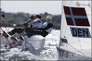 USA's Anna Tunnicliffe, Debbie Capozzi and Molly O'brian challenge against Denmark.