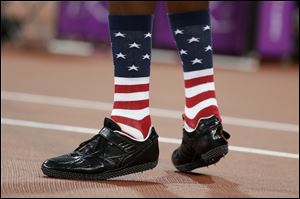 United States' Erik Kynard walks on the track during the men's high jump final during the athletics in the Olympic Stadium at the 2012 Summer Olympics, London.