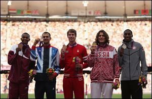 Silver medalist Erik Kynard, right, of the United States, gold medalist Ivan Ukhov, second from right, of Russia and joint bronze medalist Derek Drouin, center, of Canada, Robert Grabarz, second from left, of Great Britain and Mutaz Essa Barshim, left, of Qatar pose on the podium during the medal ceremony for the Men's High Jump.