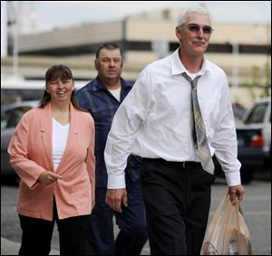 David Stone, right,  and wife Tina Stone, left, arrive at the Federal courthouse in Detroit.