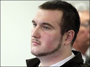Samuel Williams listens as Judge Dean Mandros sentences him.