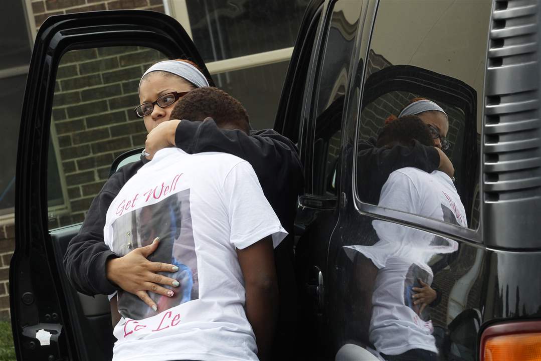 Shantia-Hamilton-of-Toledo-left-comforts