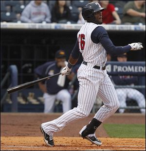 Toledo shortstop Audy Ciriaco hits a single during the second inning against the Durham Bulls.