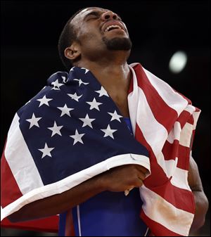 Jordan Burroughs celebrates his freestyle 74-kilogram division title Friday to give the U.S. its first wrestling gold medal in London.