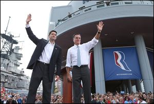 Wisconsin Rep. Paul Ryan waves with former Massachusetts Gov. Mitt Romney after Mr. Romney announces he's chosen the seven-term congressman as his running mate on the GOP ticket.