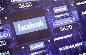 Electronic screens inside the Nasdaq stock market announce the listing of Facebook shares before the start of trading in New York. In May, when investors tripped over themselves to have a piece of Facebook, not even the skeptics predicted what has happened since. Three months after the offering, shares have lost more than 40 percent of their value, closing at just under $21.81 Friday, from $38 on May 18.