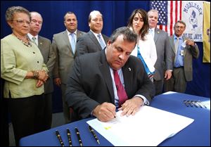 Gov. Chris Christie, shown here signing a bill changing teacher tenure requirements in New Jersey, will be a keynote speaker at the Republican national convention.