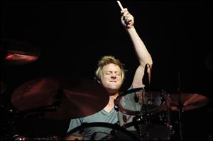 Train drummer Scott Underwood performs at the Toledo Zoo. The band played fan favorites and new material from 'California 37.'