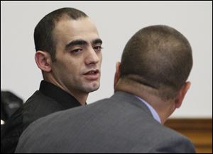 Former carryout clerk Bandar Abu-Karsh speaks to his attorney, JohnMcMahon, before being acquitted of voluntary manslaughter.