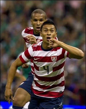 American Michael Orozco Fiscal, front, celebrates after scoring the only goal in the friendly against Mexico.