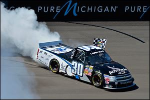 Nelson Piquet, Jr., won the Camping World Trucks series race at Michigan International Speedway on Saturday.