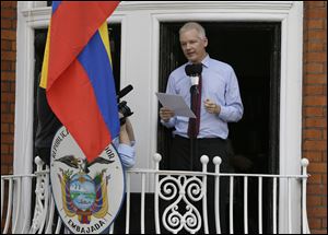 Julian Assange, founder of WikiLeaks makes a statement from a balcony of the Equador Embassy in London. Assange called on United States President Barack Obama to end a 
