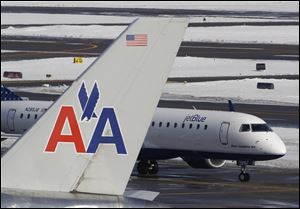 Flight attendants at American Airlines voted to approve a new contract offer from the airline, which is seeking to cut costs in bankruptcy protection. The results released Sunday showed attendants voted to accept the contract by 59.5 percent to 40.5 percent, according to the Association of Professional Flight Attendants.