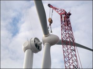 A rotor is attached to a wind turbine that produces energy for Cooper Farms in Paulding County.