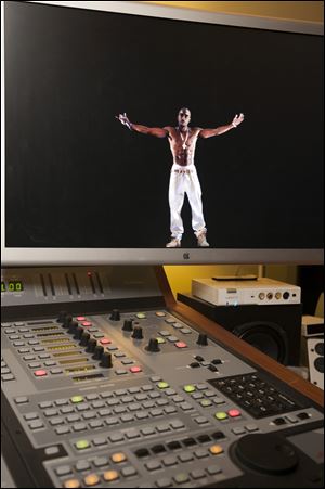A video image of the Tupac Shakur hologram is displayed on a computer monitor at the Subtractive Studio in Santa Monica, Calif. When Tupac Shakur rose from the stage in the California desert earlier this year, it was not only a jaw-dropping resurrection, but also the beginning of a new form of live entertainment.