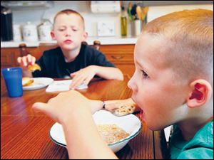 Ethan, 5, right, is allergic to peanuts and isn’t allowed to eat at anyone else’s home. He also only eats his own lunch at school.