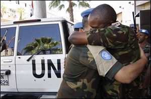U.N. observers arrive at a hotel in Damascus. Hours after the United Nations officially ended its peacekeeping efforts, Syrian forces pummeled Aleppo with airstrikes and tanks and shelled parts of Damascus, killing at least 100 people.