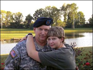'The Invisible War' also features Seaman Recruit Hannah Sewell, U.S. Navy, shown with her father, Sgt. Major Jerry Sewell.
