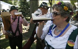 John and Christine Griffith of the German band Ein Prosit enjoy a beer.
