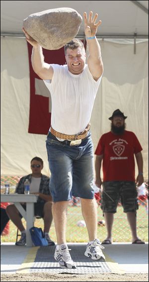 Isaac Hubbard of Toledo competes in the Steinstossen competition.