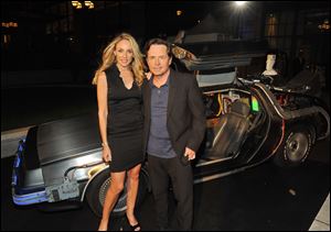 Michael J. Fox, shown with his wife, Tracy Pollan, will return to prime-time television in 2013 with a family comedy on NBC. The network has committed to air a full 22-episode season.