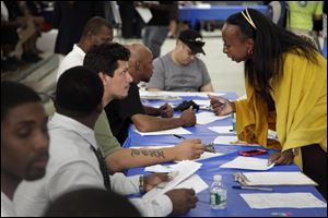 Job seekers fill out applications at a recent construction job fair in New York. 