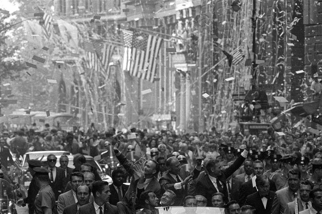 Amid-ticker-tape-and-American-flags-Apollo-11