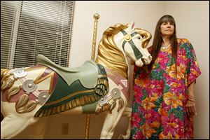 Lynn Burns, of West Toledo, christened this hollowed-out replica carousel horse 
