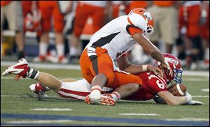 Kevin Kronbach of St. Francis recovers a fumble by Southview’s Austin Valdez. The Knights capitalized by marching 48 yards downfield to take a 16-12 lead.