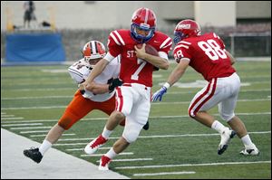 St. Francis’ David Nees is pushed out by Southview’s Myles Magnus. Nees had the game-winning touchdown pass to Andrew Bonfiglio.