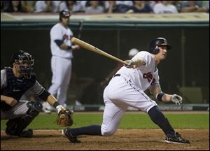 Indians batter Jack Hannahan hits a ground out to Yankees first baseman Mark Teixeira, as catcher Russell Martin watches, to end the  game in Cleveland on Friday.