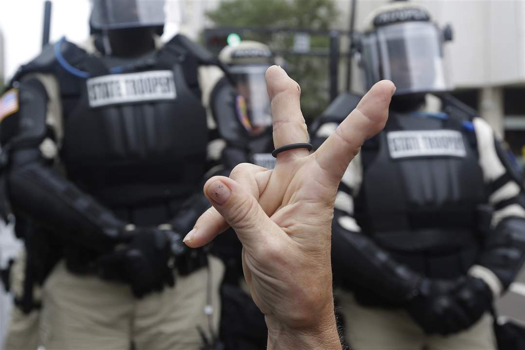 APTOPIX-Republican-Convention-Protests-peace-sign