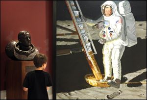 Ezekiel Howie, 9, gazes at a portrait of Neil Armstrong during a visit to the Armstrong Air & Space Museum in Wapakoneta, Ohio. Ezekiel was on a field trip Tuesday with his mother and brother.