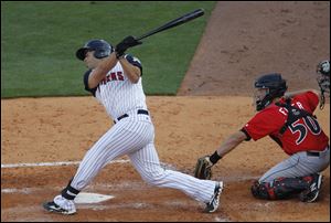 Mud Hen John Lindsey swings and misses during game at Fifth Third Field Wednesday. Lindsey struck out, abandoning 2 runners on base bottom of the 3rd inning. 