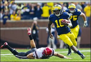 Denard Robinson is second all-time among Big Ten quarterbacks in career rushing yards. Teammates recently paid tribute to his overall character when they picked him to be a team captain.