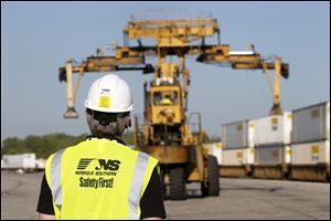 A crane unloads a cargo container at Norfolk Southern's $12.4 million Toledo Intermodal terminal, which was dedicated Wednesday.