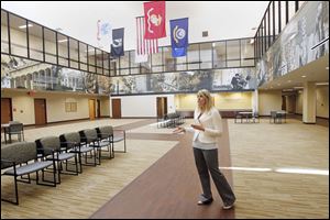 Amy Murbach, the project manager, explains the features of the new VA Outpatient Clinic while standing in the entrance room. The additional space allows the clinic to expand its services to veterans.