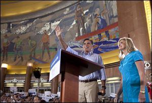 Accompanied by his wife, Ann, Mitt Romney acknowledges cheers at Cincinnati's Union Terminal.